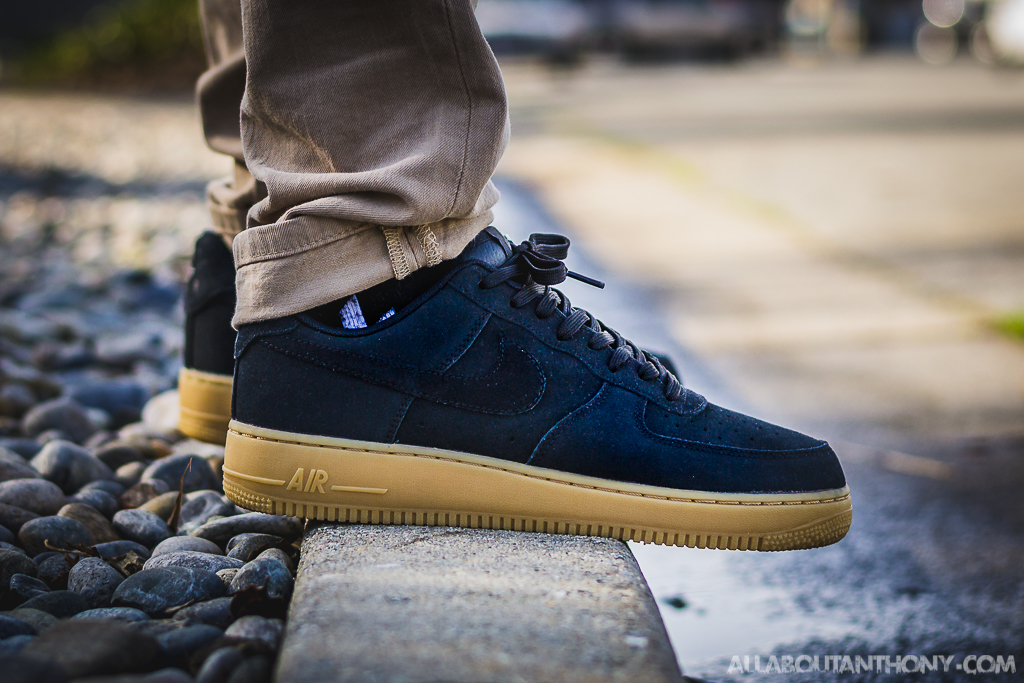 black air force ones on feet