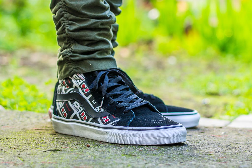 all black vans on feet