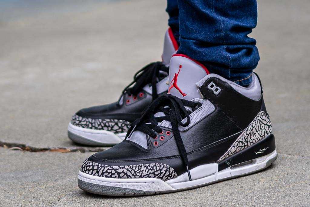 retro 3 black cement on feet