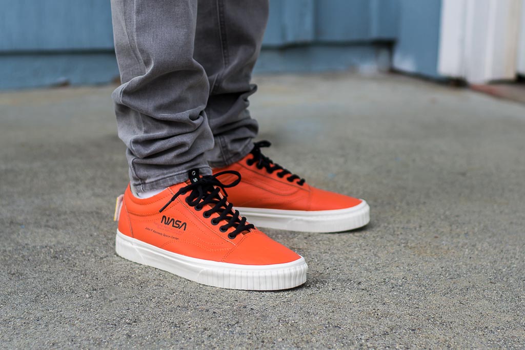 orange vans on feet